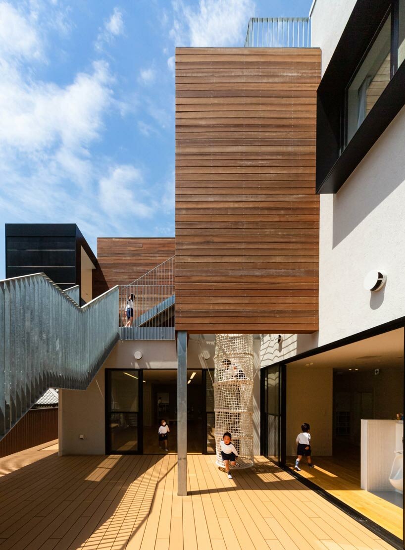 permeable vertical louver envelops HIBINOSEKKEI + youji no shiro's RJ nursery in japan