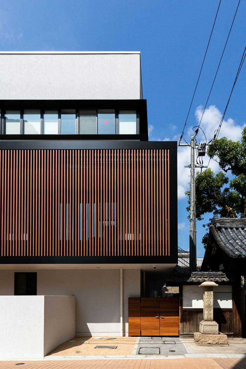 permeable vertical louver envelops HIBINOSEKKEI + youji no shiro's RJ nursery in japan