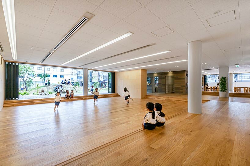 permeable vertical louver envelops HIBINOSEKKEI + youji no shiro's RJ nursery in japan