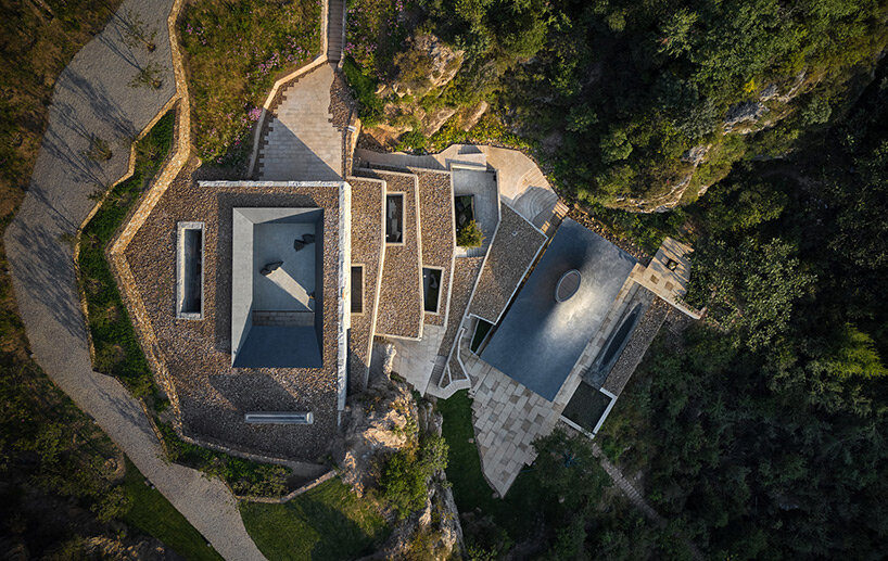 sculptural carbon fiber roof funnels light into atelier deshaus' meditation hall in china