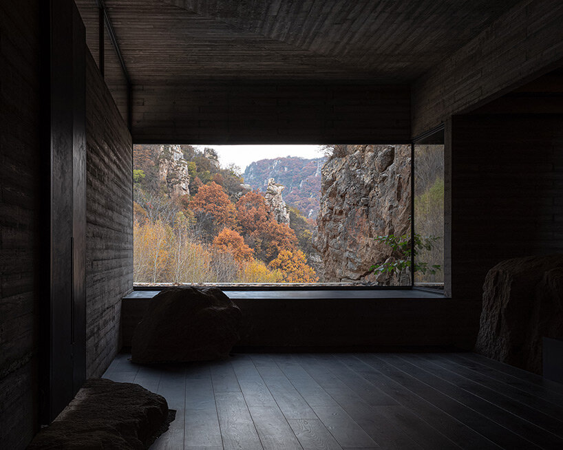 sculptural carbon fiber roof funnels light into atelier deshaus' meditation hall in china