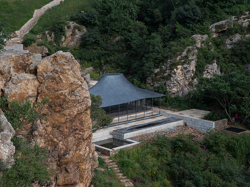 sculptural carbon fiber roof funnels light into atelier deshaus' meditation hall in china