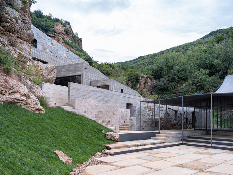 sculptural carbon fiber roof funnels light into atelier deshaus' meditation hall in china