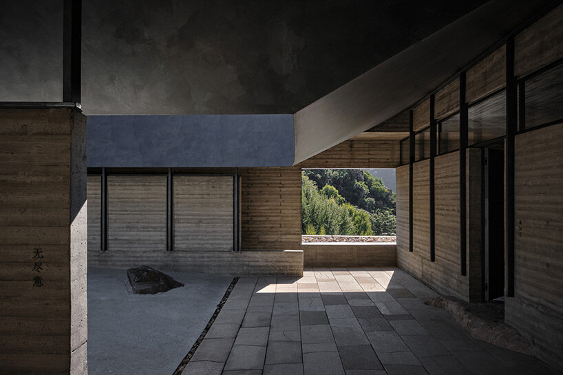 sculptural carbon fiber roof funnels light into atelier deshaus' meditation hall in china