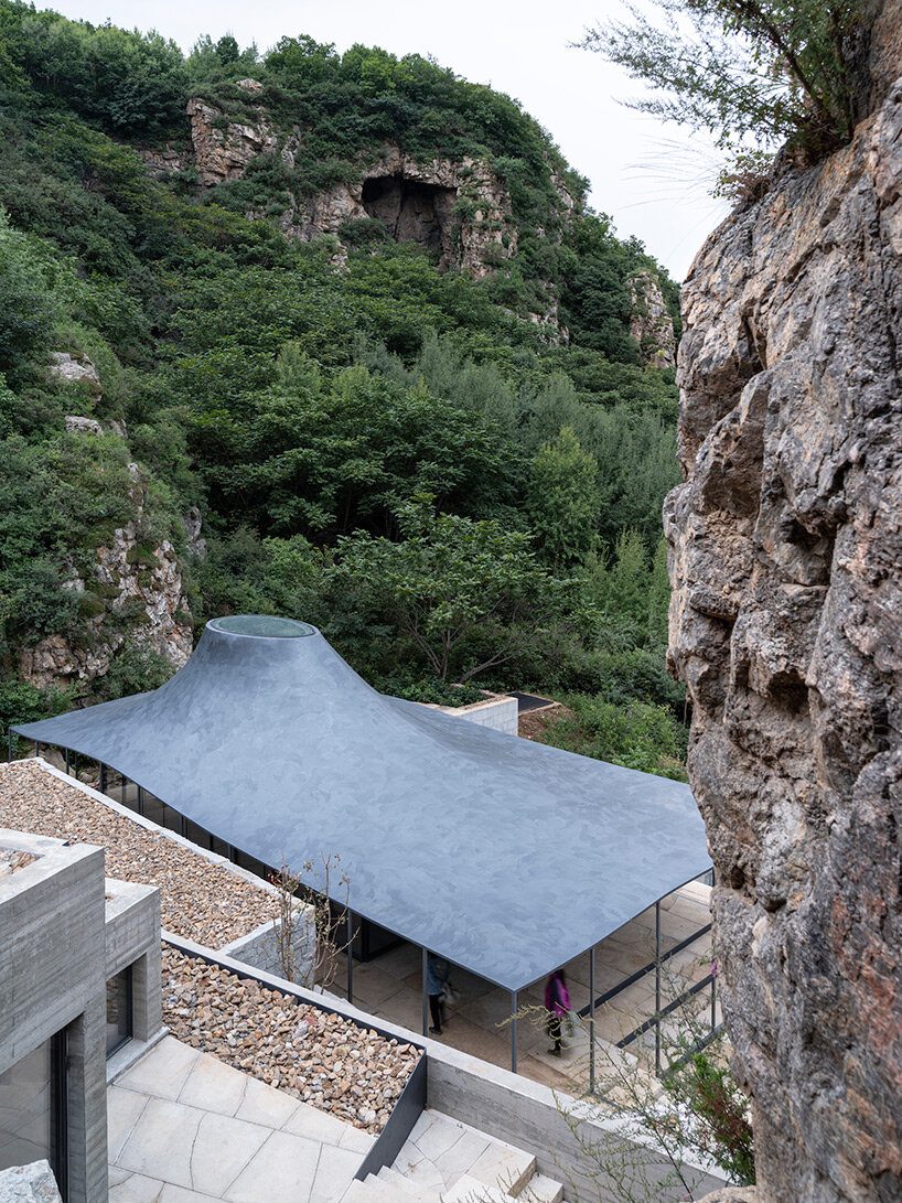 sculptural carbon fiber roof funnels light into atelier deshaus' meditation hall in china