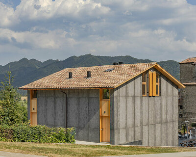 SAU taller elevates typical catalan farmhouse with concrete and timber 'vivet houses'