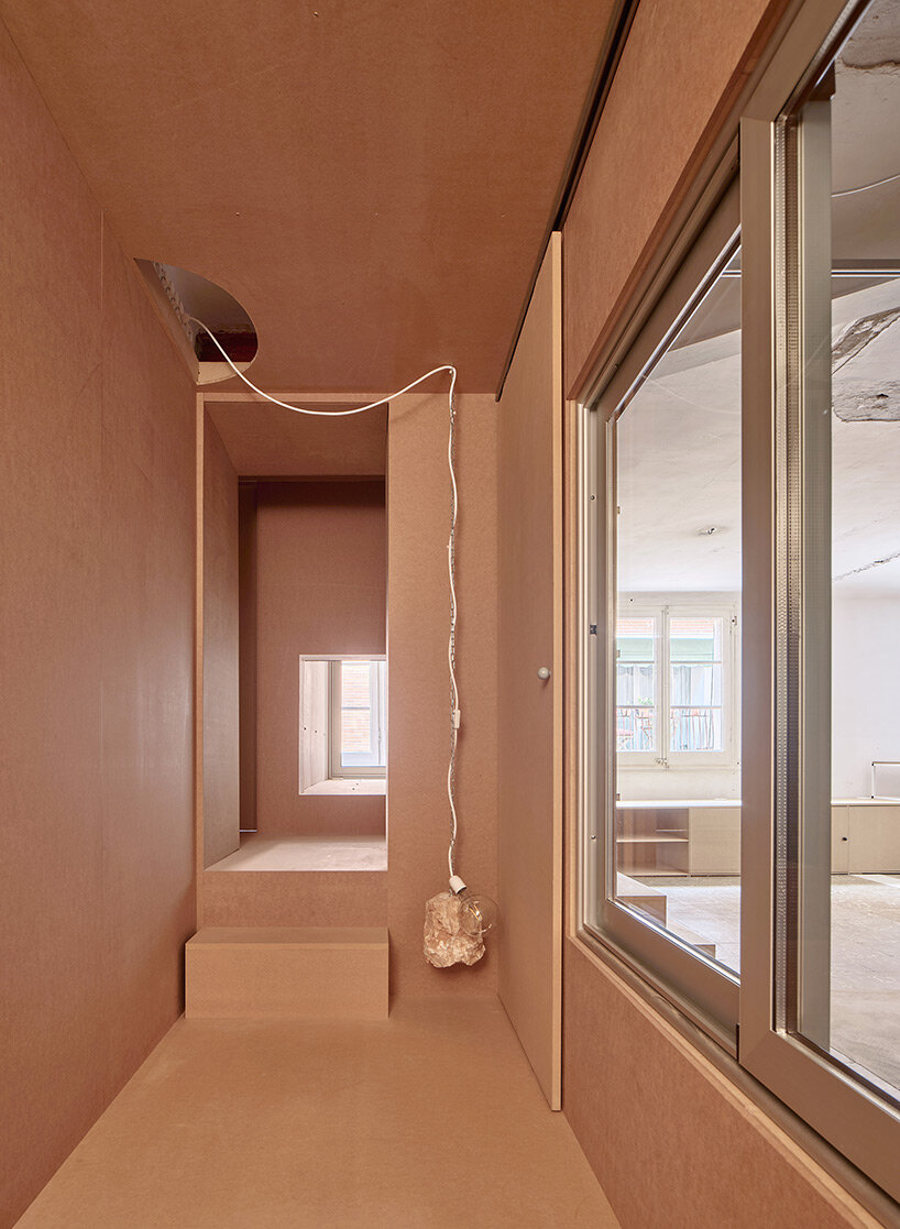 TAKK exposes old partitions + electrical installations in energy-conscious barcelona revamp