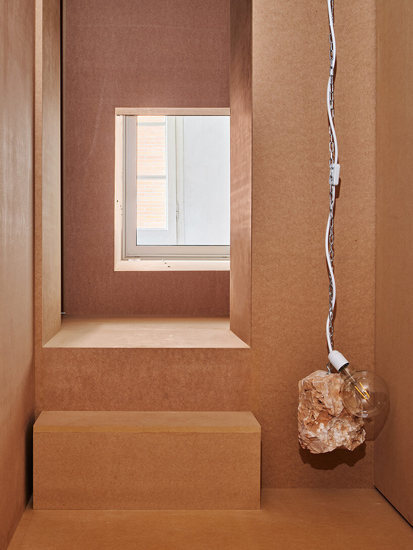 TAKK exposes old partitions + electrical installations in energy-conscious barcelona revamp