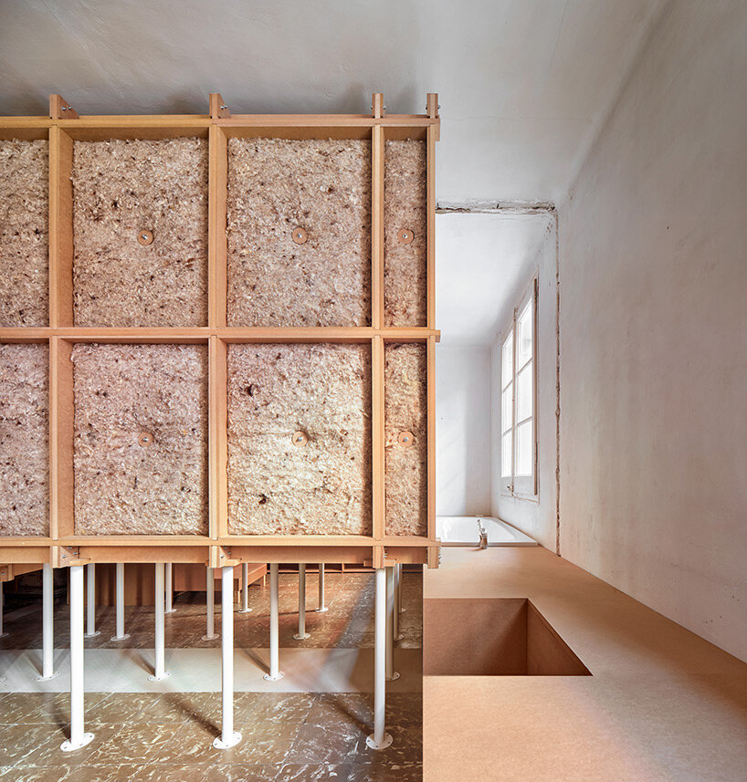 TAKK exposes old partitions + electrical installations in energy-conscious barcelona revamp