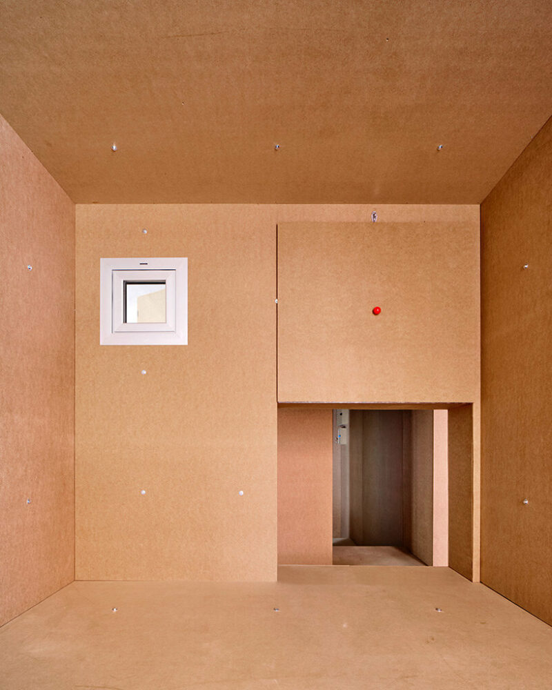 TAKK exposes old partitions + electrical installations in energy-conscious barcelona revamp