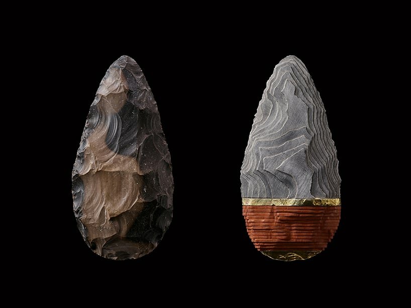a knapped flint hand-axe and its rebirthed self, after sectioning and reassembling in stainless steel and leather