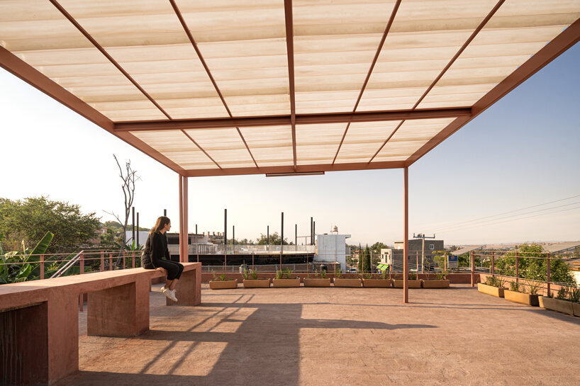 vaulted brickwork community center built by the citizens adorns rural mexico