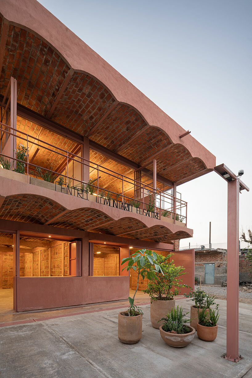 vaulted brickwork community center built by the citizens adorns rural mexico