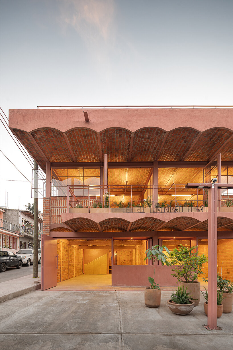 vaulted brickwork community center built by the citizens adorns rural mexico