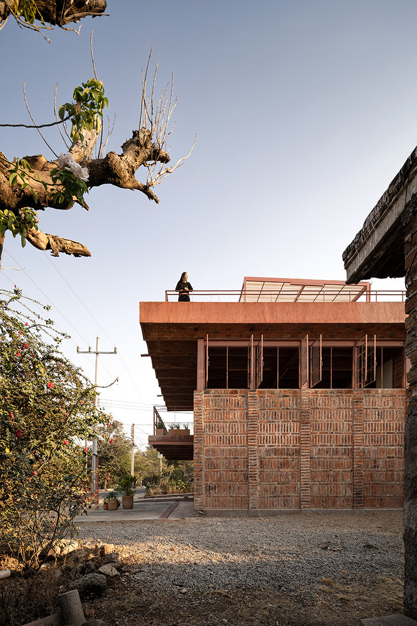 vaulted brickwork community center built by the citizens adorns rural mexico