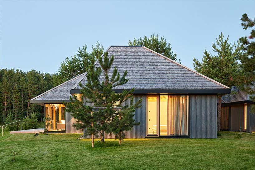 in the picturesque hills of lithuania, a cluster of guest houses by HEIMA gaze skywards