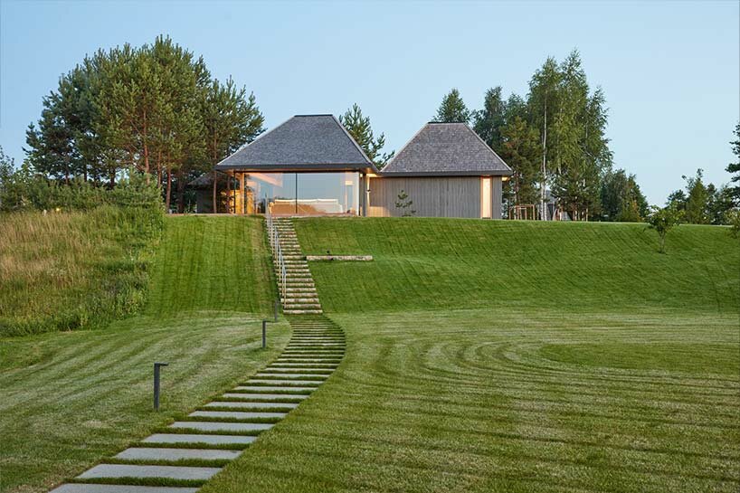 in the picturesque hills of lithuania, a cluster of guest houses by HEIMA gaze skywards