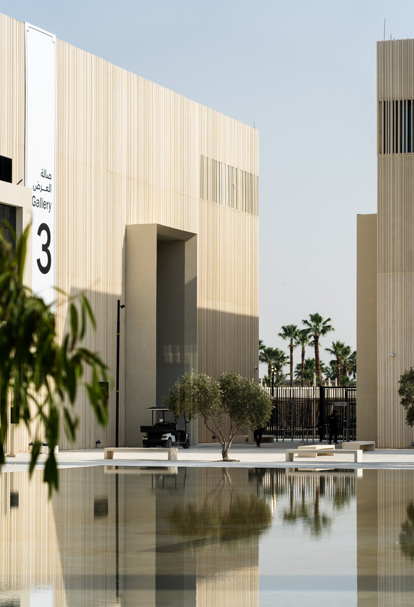 clusters of volumes & voids weave through airport terminal for islamic arts biennale complex in jeddah