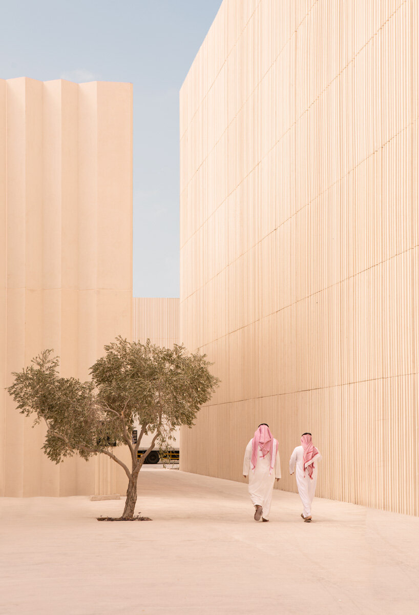 clusters of volumes & voids weave through airport terminal for islamic arts biennale complex in jeddah