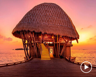 weaved bamboo roofs enclose pavilions for wellness resort in the maldives
