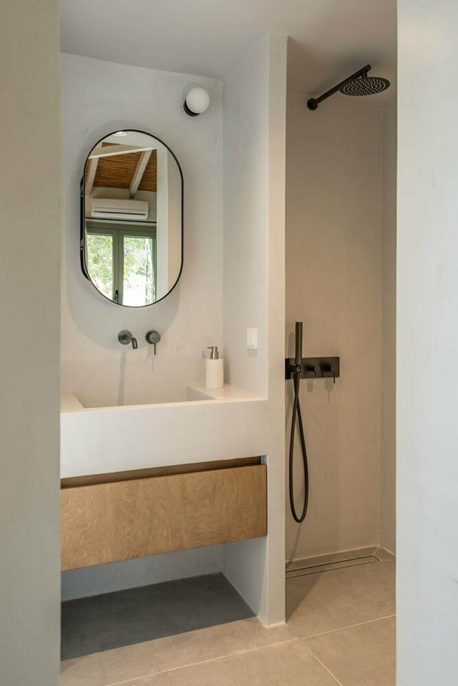 the aesthetics of the bathrooms form in minimal design extensively using micro cement coating