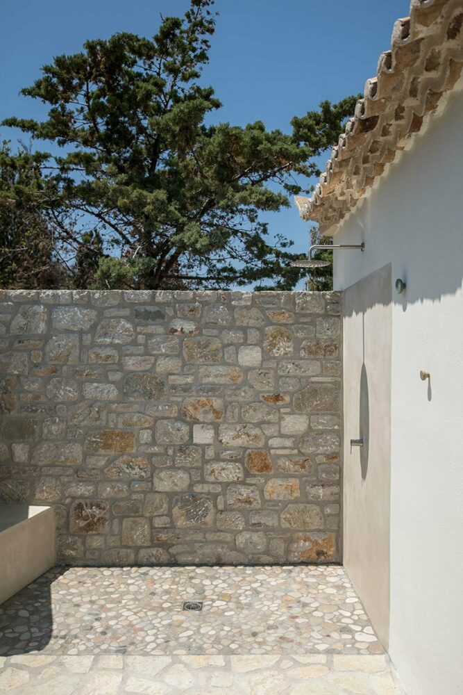 an outdoor shower is shaped to give a cooling break during the hot summer days