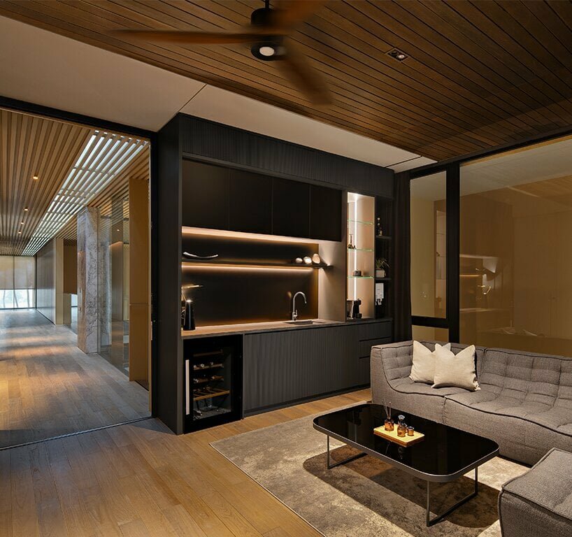 the master bedroom and bathroom along with the family lounge stand parallel to the central axis of the house