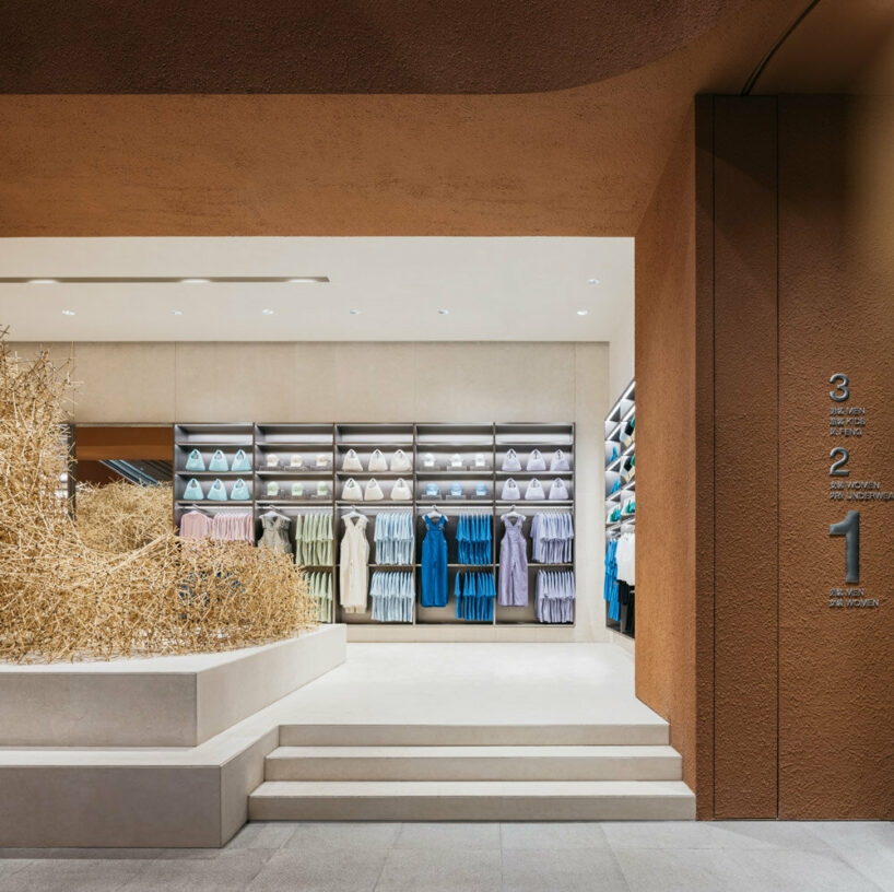 woven bamboo installation by AIM architecture drapes over fashion store ...