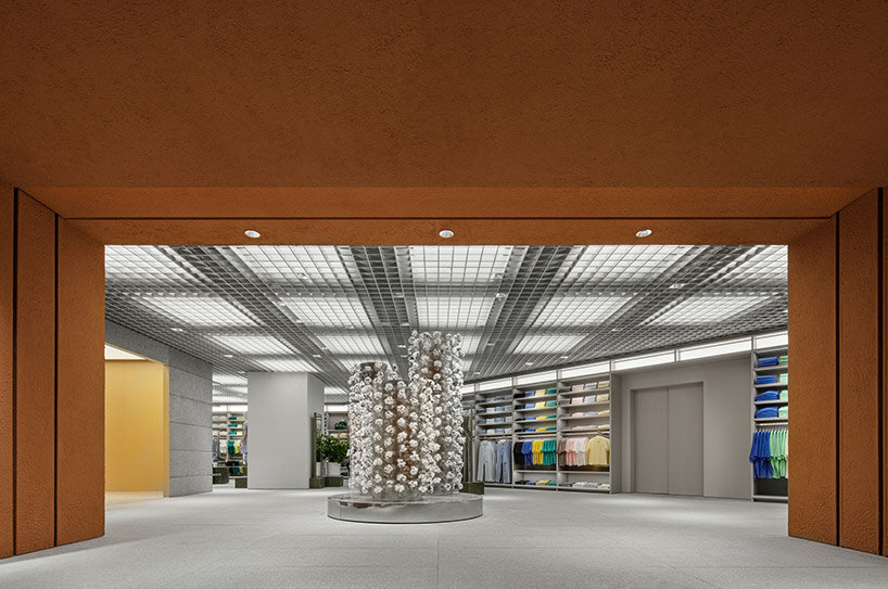 woven bamboo installation by AIM architecture drapes over fashion store atrium in china