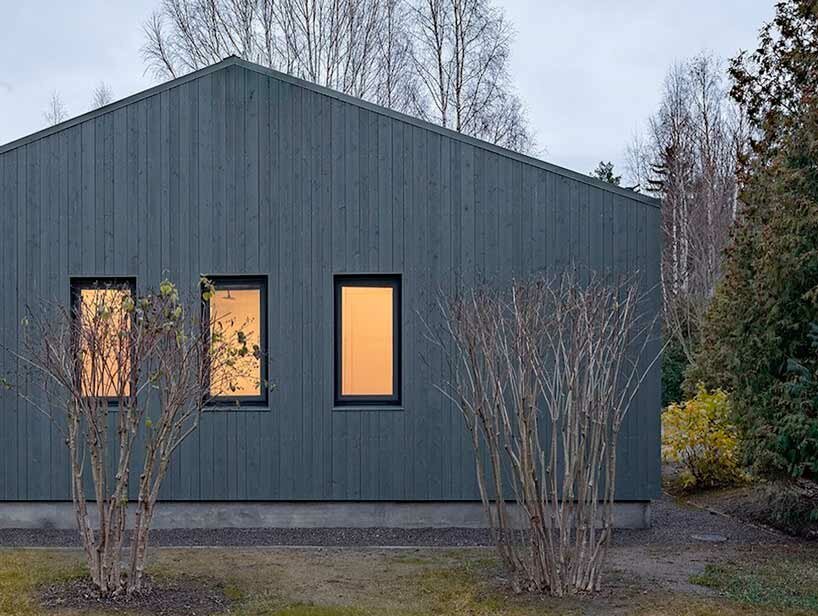 gray softwood boards contour the solid frame of 'delo house 4' in russia