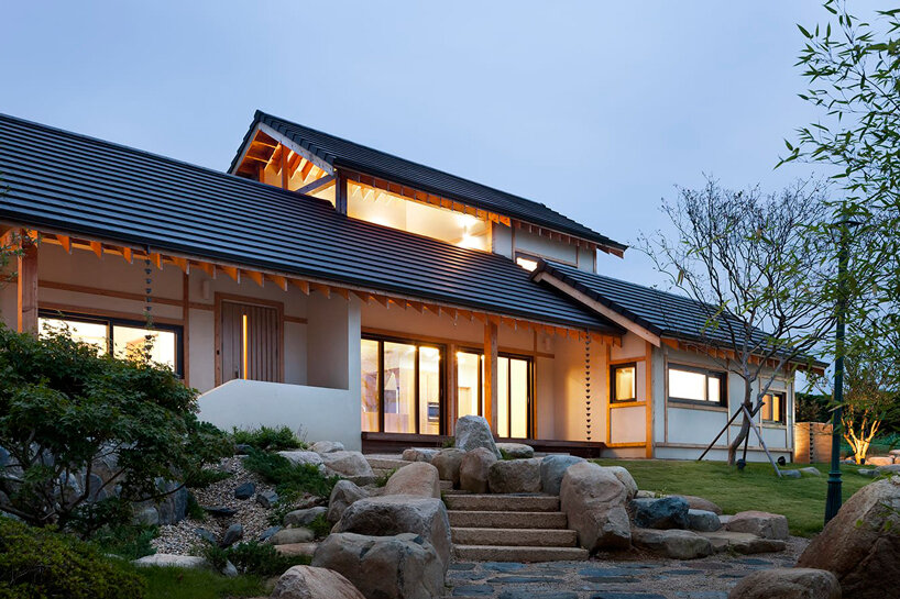 studio_GAON frames korean mountainous landscape through contemporary wooden hanok