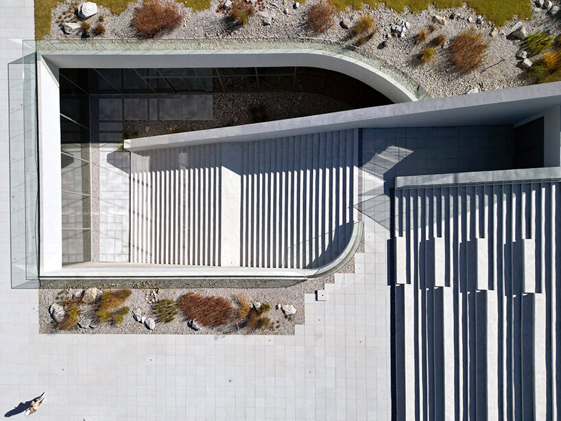 LESS architects weaves new clubhouse into the hilly landscape of wonju in south korea