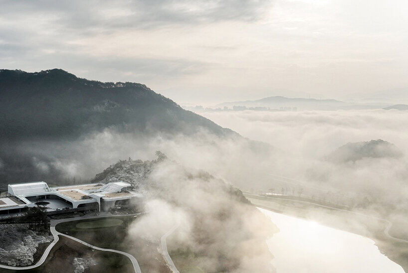 LESS architects weaves new clubhouse into the hilly landscape of wonju in south korea