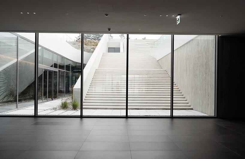 LESS architects weaves new clubhouse into the hilly landscape of wonju in south korea