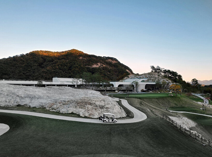 LESS architects weaves new clubhouse into the hilly landscape of wonju in south korea