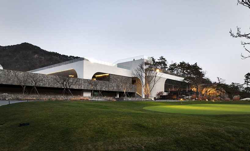 LESS architects weaves new clubhouse into the hilly landscape of wonju in south korea