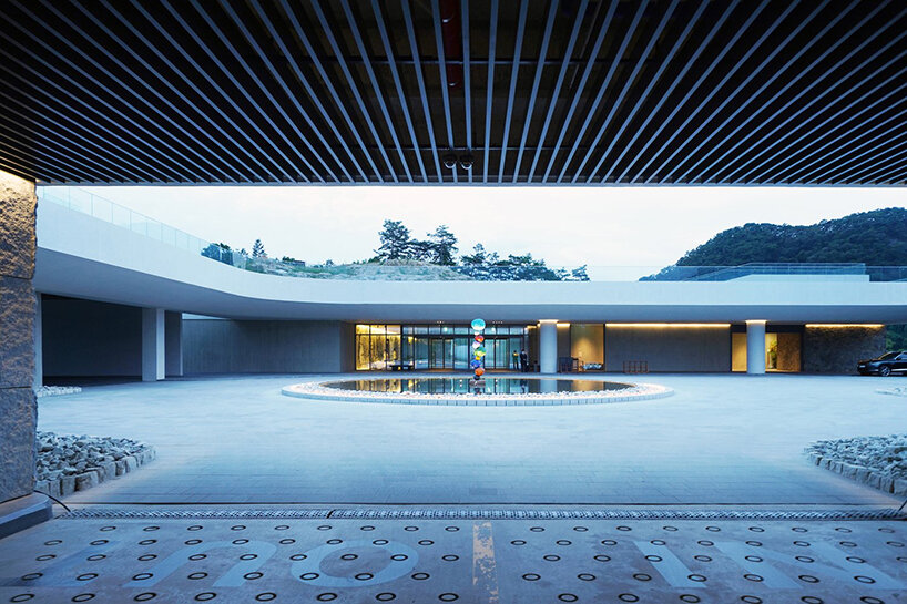 LESS architects weaves new clubhouse into the hilly landscape of wonju in south korea