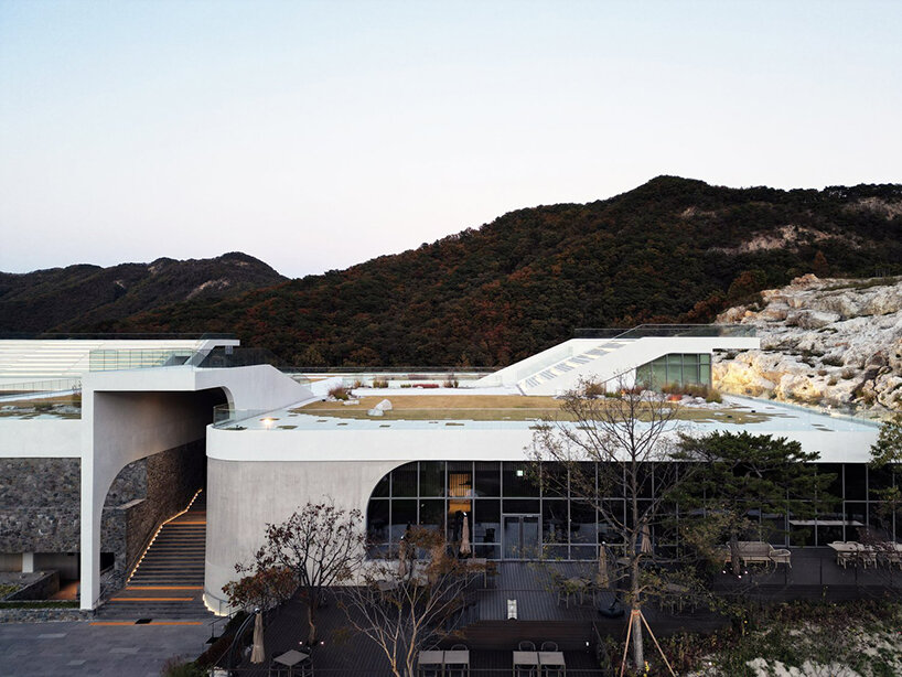 LESS architects weaves new clubhouse into the hilly landscape of wonju in south korea