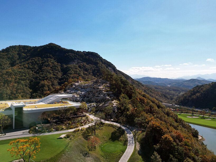 LESS architects weaves new clubhouse into the hilly landscape of wonju in south korea
