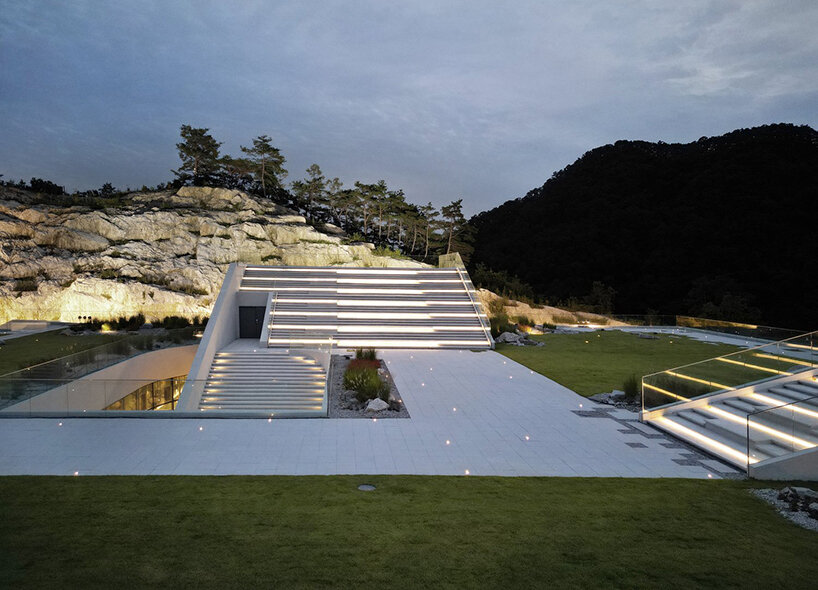 LESS architects weaves new clubhouse into the hilly landscape of wonju in south korea