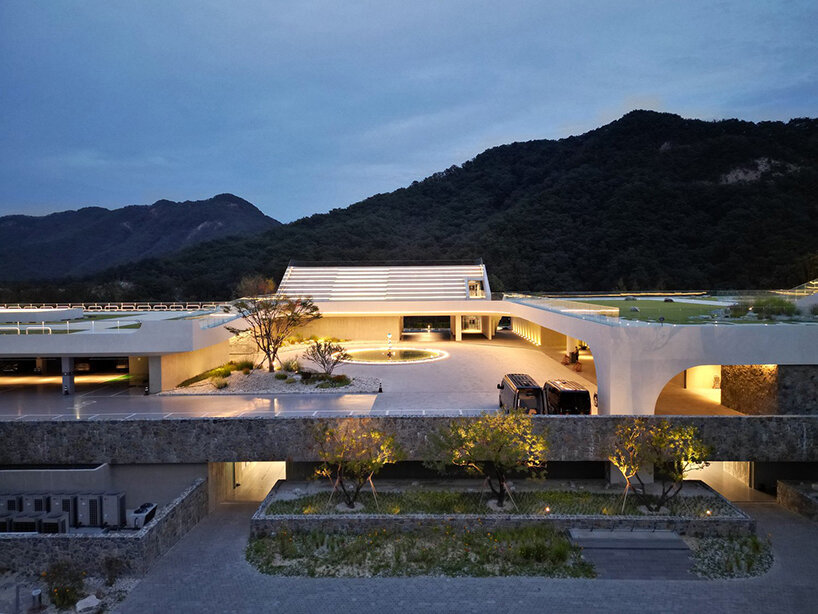 LESS architects weaves new clubhouse into the hilly landscape of wonju in south korea