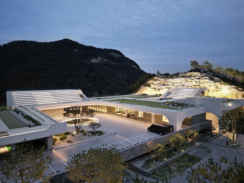 LESS architects weaves new clubhouse into the hilly landscape of wonju in south korea