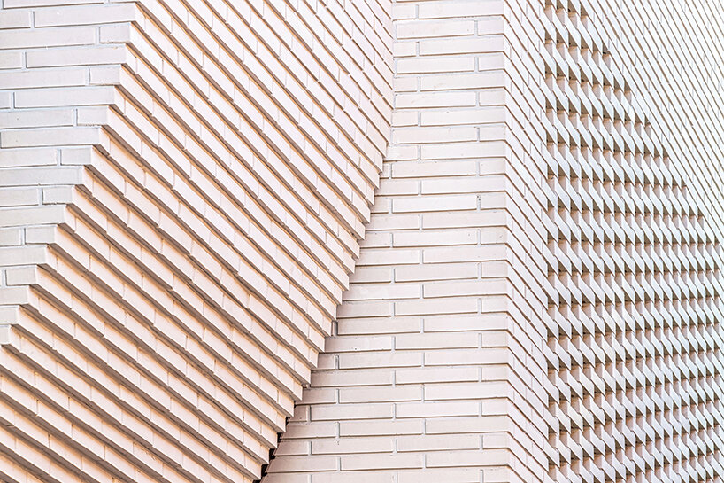 a curved brick wall ripples across LESS architects’ office building design in seoul