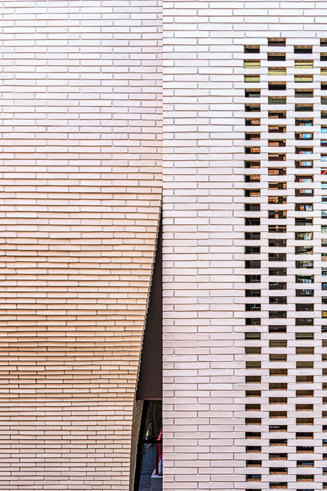 a curved brick wall ripples across LESS architects’ office building design in seoul