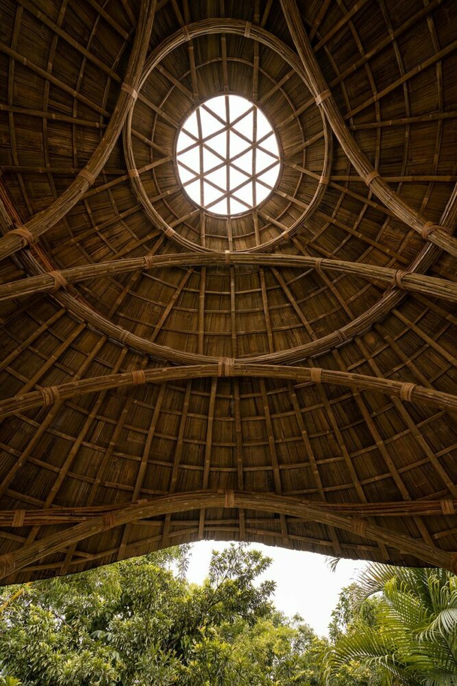 locally harvested bamboo & cane shape this sculptural meditation gazebo in tamil nadu, india
