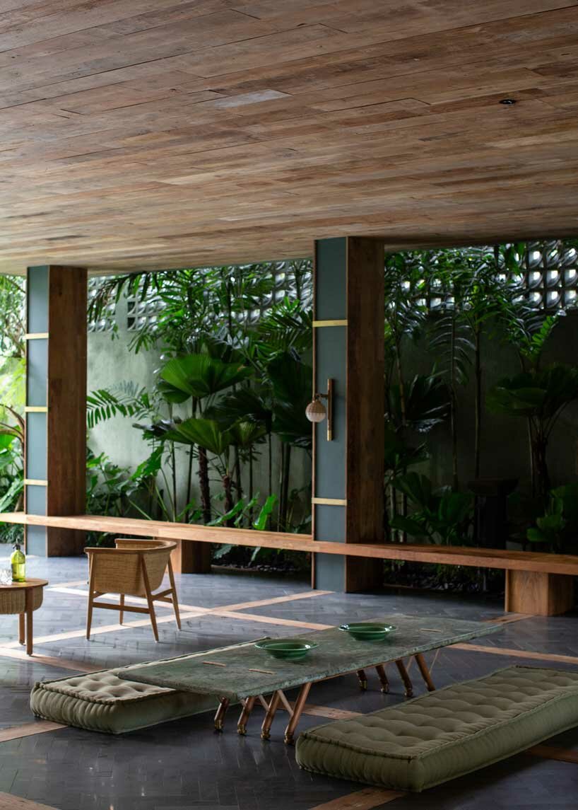 perched amidst a forest in bali, the ravine dwelling blurs the line between indoor & outdoor