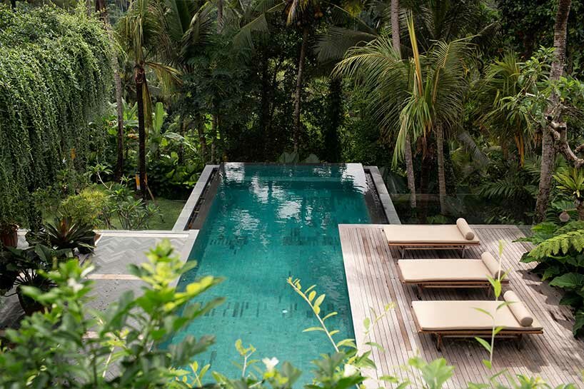 perched amidst a forest in bali, the ravine dwelling blurs the line between indoor & outdoor