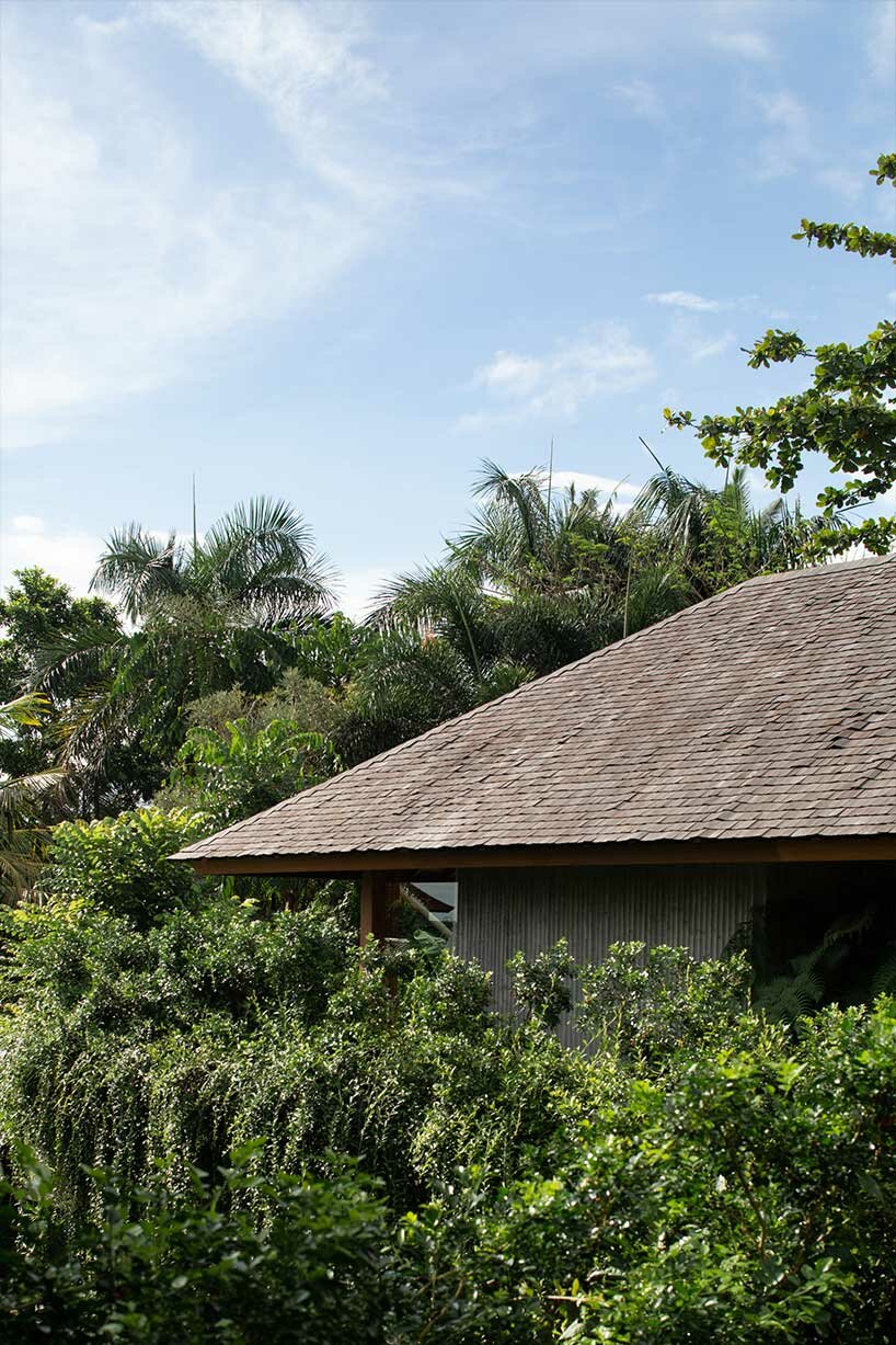 perched amidst a forest in bali, the ravine dwelling blurs the line between indoor & outdoor