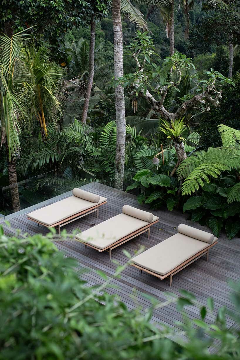 perched amidst a forest in bali, the ravine dwelling blurs the line between indoor & outdoor