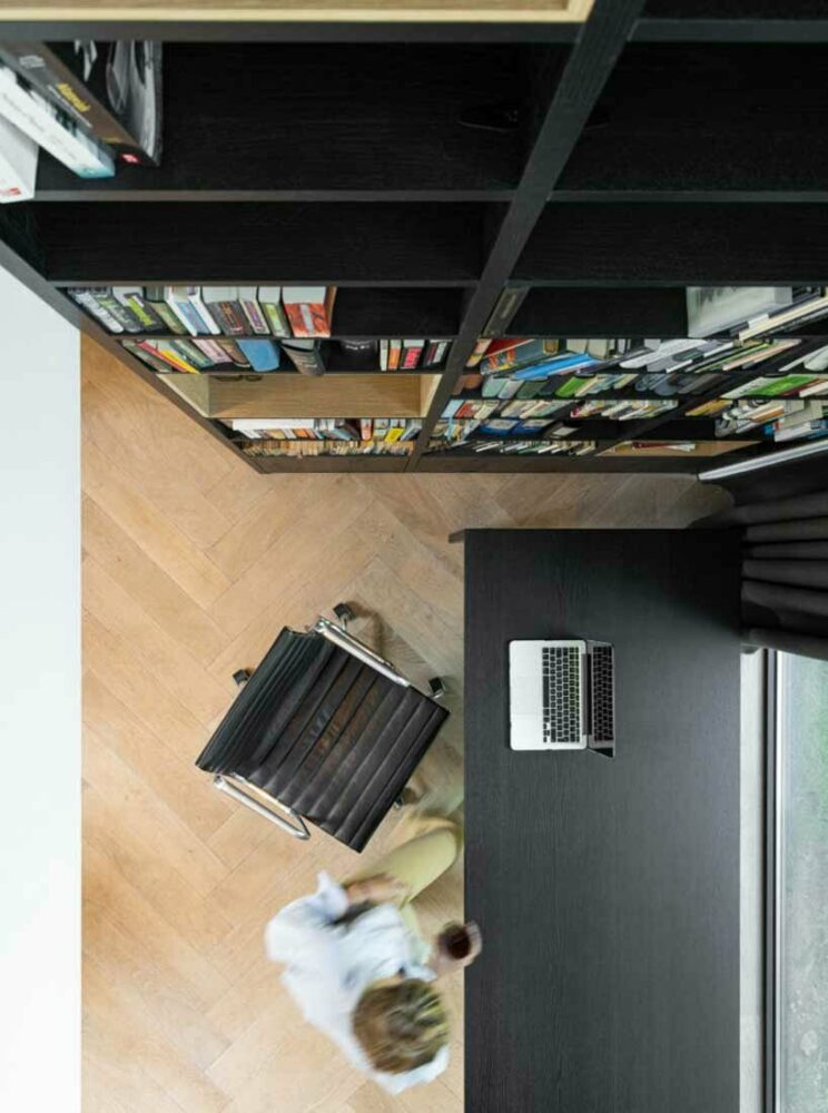 the bookcase serves as a room partition